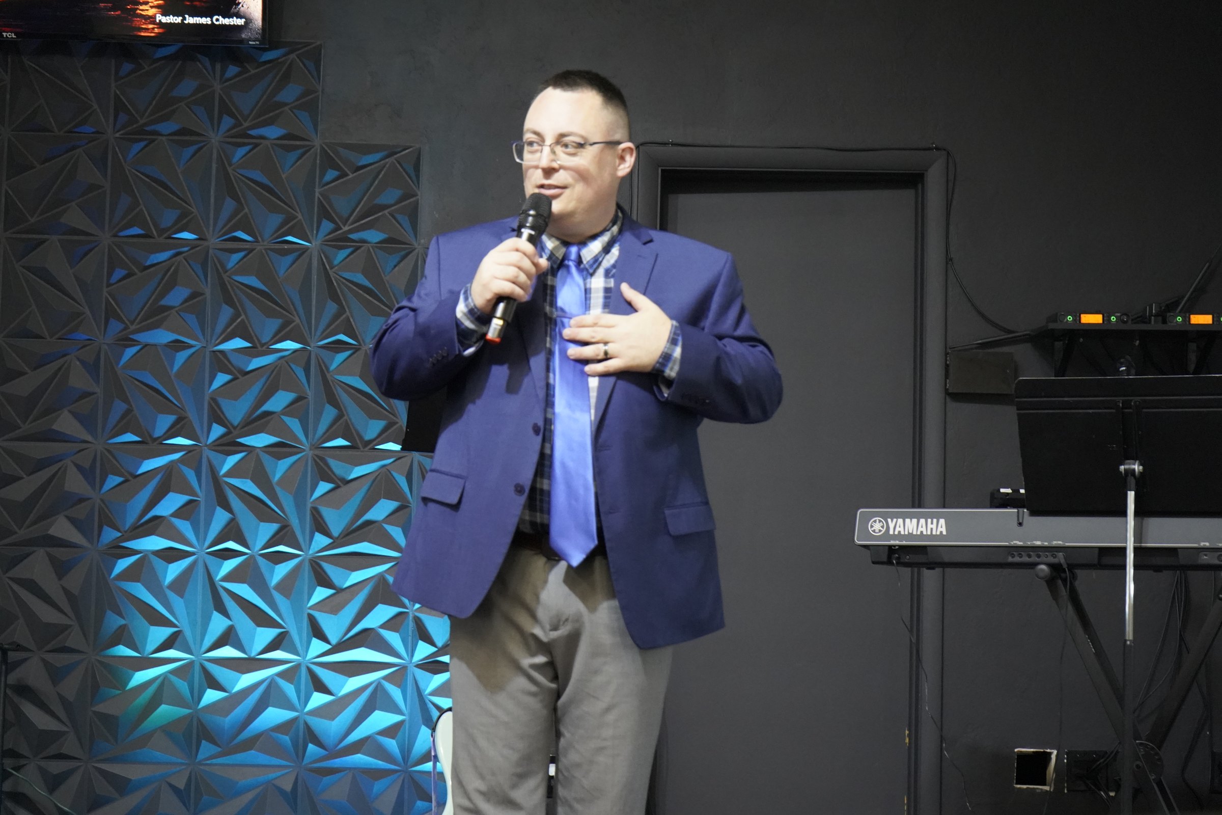 Pastor James Chester preaching at Refuge Church